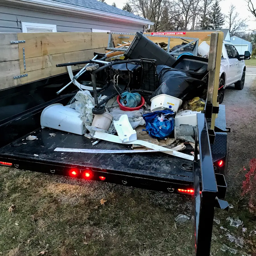 Roll-off dumpster delivered to a residential driveway in DeKalb