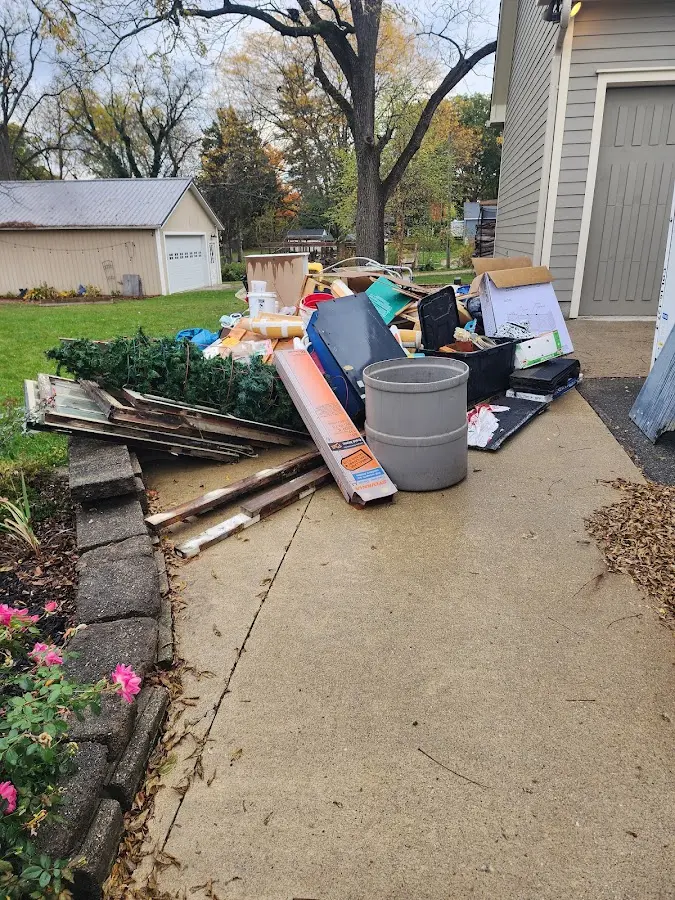 Dumpster being loaded with debris for Residential Dumpster Rental in DeKalb